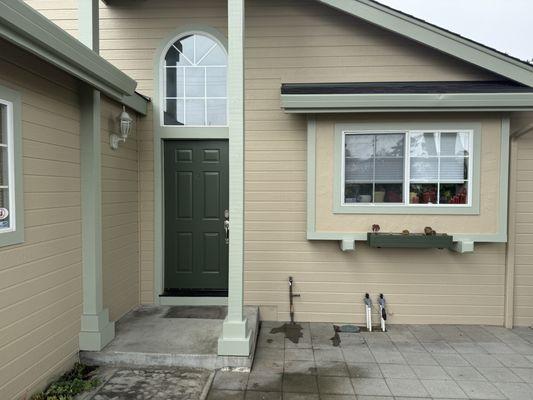 Dark green front door is a nice contrast.