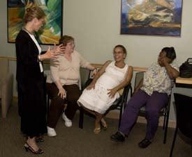 Dr. Skul in the waiting room talking with patients.