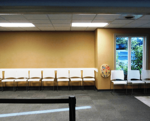 Drivers License waiting area with toy on the wall for little kid.  Photo cc: official website