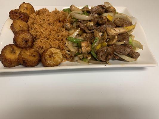 lamb Caraba with jollof rice and plantains