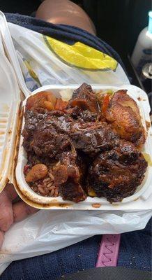 Oxtails mini with plantains, cabbage,rice and peas. So good and fresh