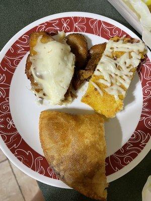 Mixture of arepitas, pabellon empanada, and cachapa.