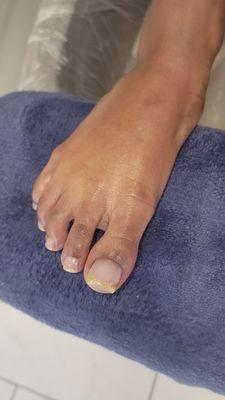 "C"  1st time at our salon. She's getting acrylics on her 2 big toes and classic pedicure service   this is an after photo