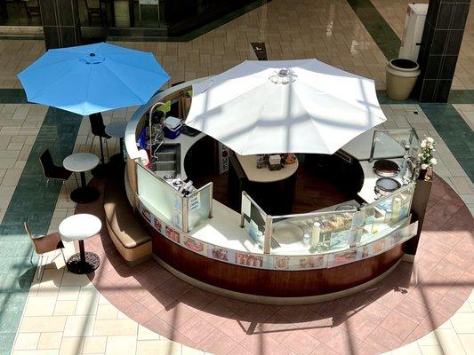 Circular counter in center of the mall 1st level near escalators & food court - view from 2nd level