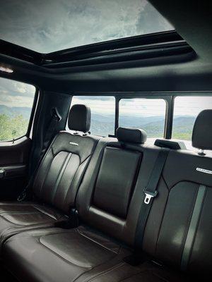 The back seat area of our Platinum Edition Ford F-150, with spacious stitched leather seats.