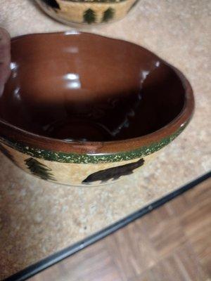 A picture of the bear bowl dish set at $200 with a missing glaze