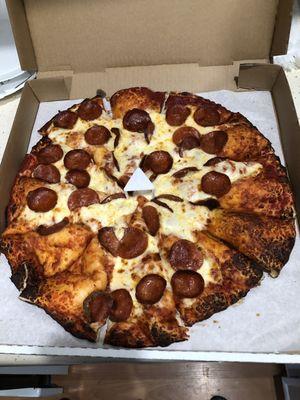 Pizza missing cheese and toppings on whole slices.