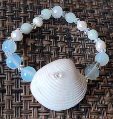 Latest bracelet made from white opal beads - Hobby Lobby& shell found Navarre Beach