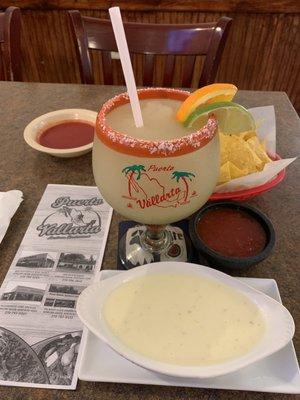 Jumbo frozen margarita, chips, salsa, and cheese dip.