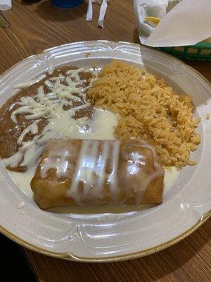 Lunch Chicken Chimichanga w/ Cheese Sauce... beans and rice are great too! Awesome Lunch Deals too!