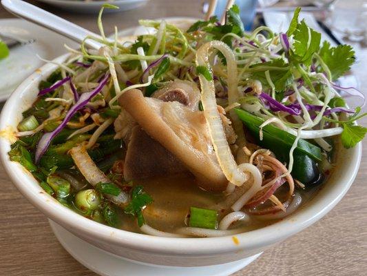 Bun bo hue- they'll serve pig foot in bun bo hue but no tripe in their pho. What the heck?