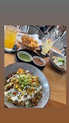 Peach margarita with a chili rim, Spicy Margarita with pineapple flavor, chips and salsa, Asada bowls (one with corn salsa added)