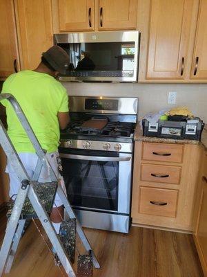 Mason with M&R installing microwave