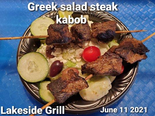 Greek salad with steak kabob