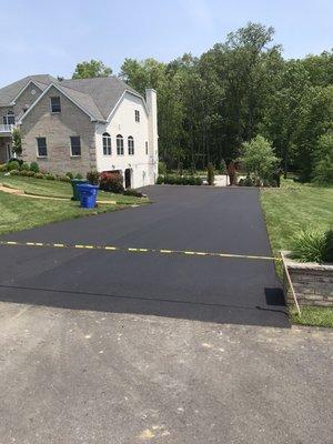 Removed old asphalt widened driveway and installed new asphalt