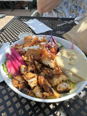 This is the Chicken bowl with Tahini dressing. The rice is there too. This hummus delicious! A pita on the side included.