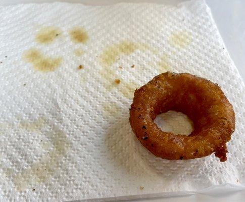 An onion ring. Needs some draining. Those grease rings from that ring