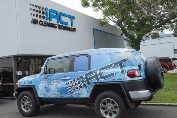 Front of our building with one of our many service vehicles.