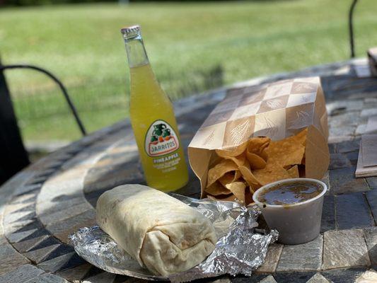 Veggie vegan burrito with crunchy chips and tasty pineapple soda!!