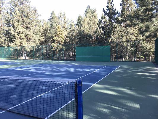 Tennis courts, with a backboard