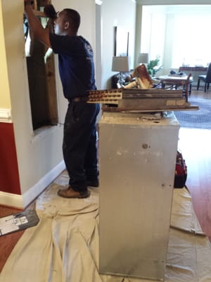 Inspecting the ductwork, wiring, and plumbing for new air handler installation