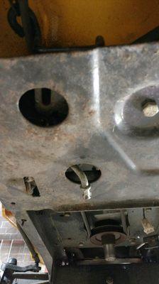 That is part of the brake assembly sticking threw the lower bracket