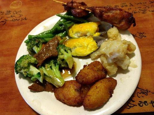 Coconut chicken and fried bananas plantain style at bottom