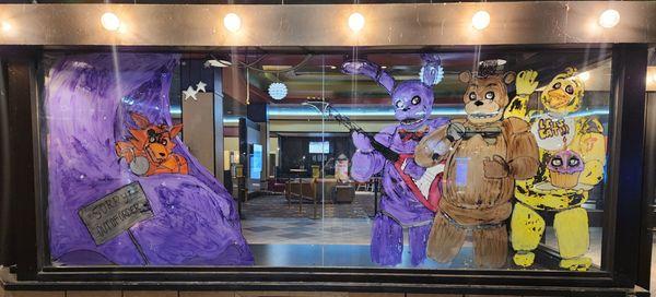 The theater decorated the window for the premiere of Five Nights at Freddy's