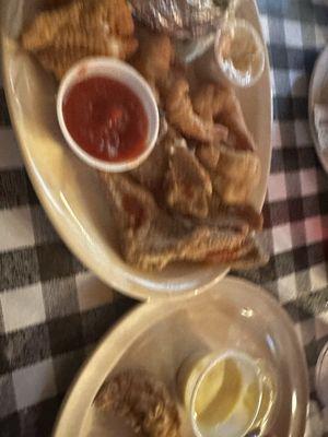 Cabin Platter with catfish strips, baked potato and chicken nuggets.