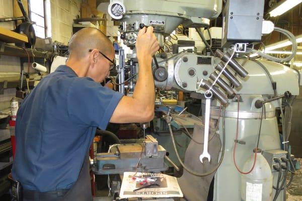 Keith at Findlay's Machine Shop, working on another irreplaceable auto part.