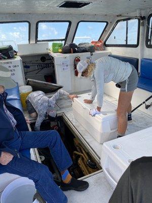 The crew trying to fix the boat.