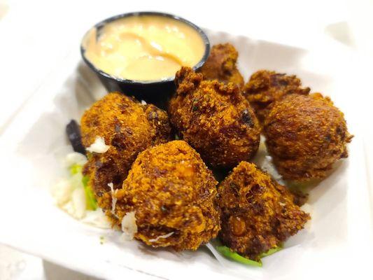 Crab & corn fritters: crab, corn, pecan smoked bacon, hatch green chile, cilantro, & spicy remoulade.