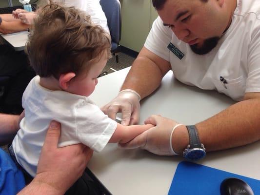 Our little one getting his testing checked by an awesome nurse!