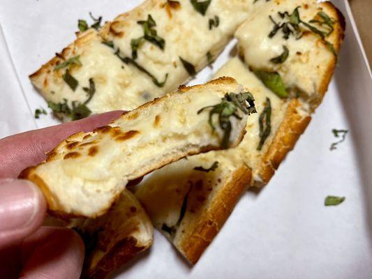 12" Garlic bread with cheese nice touch with basil on top