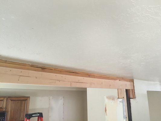 Kitchen remodel that has a wall removed now needs this beam wrapped in drywall