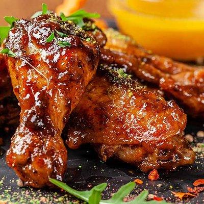 Juicy, tender chicken wings marinated in flavorful spices and cooked to perfection.