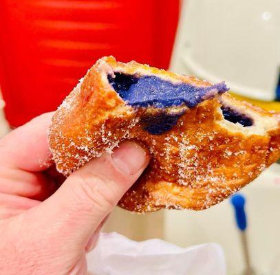 Aloha Jay's ube filled malasada. Fresh, hot, and tasty.