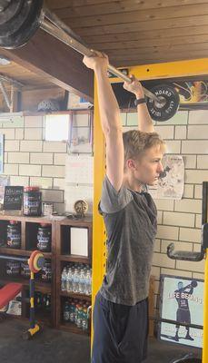 high school student lifts weights