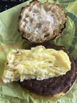 Sausage egg and cheese McMuffin. I asked for a scrambled egg instead and they cut it in half. What the heck??