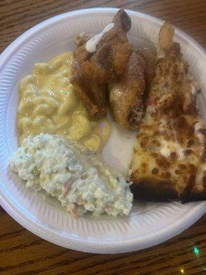 Coleslaw Mac n cheese chicken pizza and wings, they had hot, salt and vinegar, sweet and sour, butter and garlic, Parmesan, Cajun