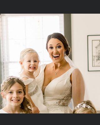 Happy Happy Bride with flower girls we did all alterations