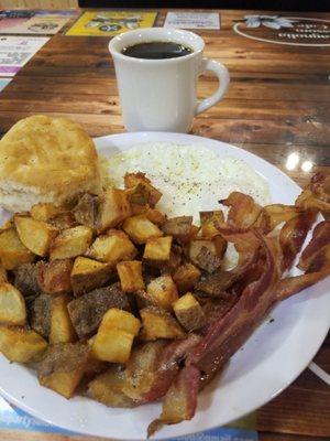 Breakfast. Eggs, bacon, home fries, and biscuits