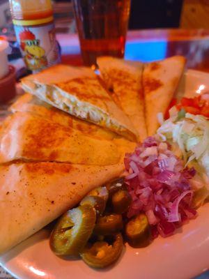 Quesadilla with chicken. Comes with lettuce, tomatoes, onions, and salsa and sour cream. Asked for jalapenos.