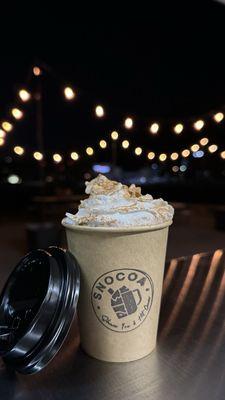 Hot cocoa with whipped cream and dusted cinnamon