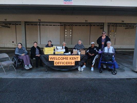 Residents giving coffee and donuts to the Police