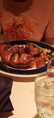 Roasted chicken with red potatoes and onions.