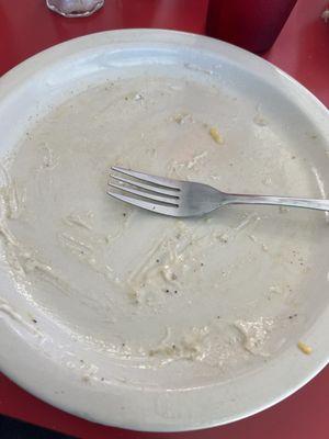 Biscuits and gravy with hash browns.