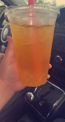 Peach fruit tea with bursting fruit boba sooo worth it.