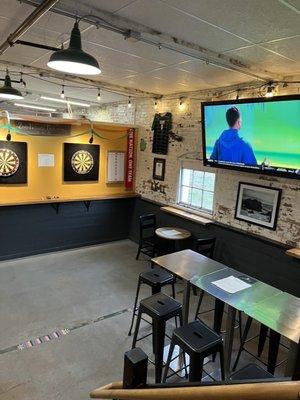 Watch soccer and play darts.