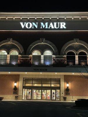 The grand entrance lit up at night.